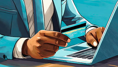 close up of business mans hands holding credit cards and using a laptop the hues of blue an